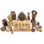 A COLLECTION OF VARIOUS BRASS AND IRON WEIGHTS to include bell weights, a set of stacking weights