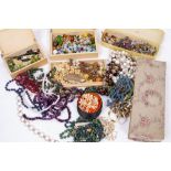 A COLLECTION OF COSTUME JEWELLERY to include glass bead necklaces, novelty lemon necklace, leaf