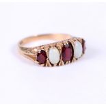 A 9 CARAT YELLOW GOLD FIVE STONE OPAL AND RED STONE RING size P 1/2, overall weight 3.3 grams