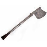 AN ANTIQUE STEEL AXE with stamped decoration and associated handle 62cm long and the blade 13.5cm