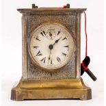 A GERMAN JUNGHANS BRASS MUSICAL MANTLE CLOCK made for the Turkish market, 13.5cm wide x 15cm high