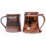 A ST IVES STUDIO POTTERY TANKARD, POSSIBLY BY DAVID LEACH, with applied scrolling handle with seal