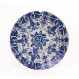 AN EARLY 19TH CENTURY TIN GLAZED DELFTWARE CHARGER with restoration, approximately 35cm