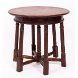 AN ANTIQUE OAK OCCASIONAL TABLE with seven turned supports united by turned stretchers, 51cm