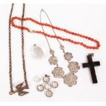 A HARDSTONE CROSS, a coral necklace, a white metal filigree necklace and further items