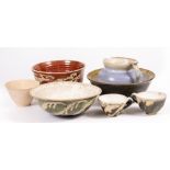 AN EXTENSIVE COLLECTION OF SYBIL PRYOR SLIPWARE STUDIO POTTERY to include bowls, plates, cups,