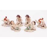 A GROUP OF SIX CONTINENTAL PORCELAIN FIGURINES depicting cavorting putti, 10.5cm long x