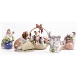 FOUR LLADRO PORCELAIN CATS and a Lladro porcelain dog, all approximately 9cm high (5)
