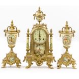 A 20TH CENTURY GERMAN GILT METAL CLOCK GARNITURE with porcelain mounts and transfer printed
