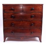 A 19TH CENTURY MAHOGANY TWO SHORT AND THREE LONG DRAWER CHEST with turned handles, standing on