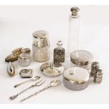 A QUANTITY OF SILVER to include two silver topped jars, two white metal pepperettes, a vesta case