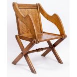 A LATE 19TH CENTURY / EARLY 20TH CENTURY OAK GLASTONBURY ARMCHAIR with a parquetry inlaid back and