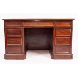 A CONTINENTAL MAHOGANY DESK with blue leather inset top and nine various drawers 130cm wide x 71cm