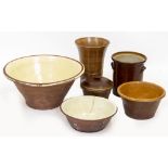 A LATE 19 / EARLY 20TH CENTURY TERRACOTTA GLAZED DAIRY BOWL together with three further bowls, a