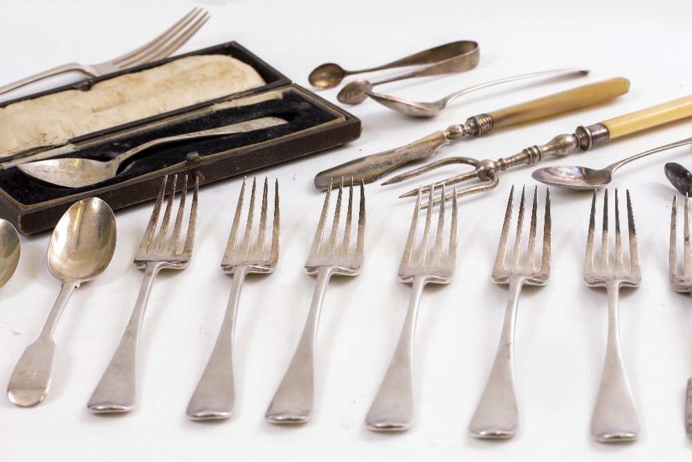 A SELECTION OF SILVER CUTLERY to include forks, teaspoons, butter knife, toasting fork, cased spoon,