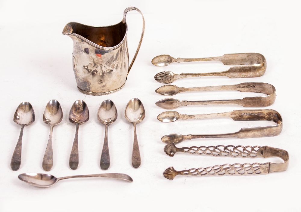 A COLLECTION OF SILVER to include four pairs of sugar tongs, Georgian cream jug with blank shield