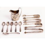 A COLLECTION OF SILVER to include four pairs of sugar tongs, Georgian cream jug with blank shield