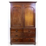 AN EARLY VICTORIAN MAHOGANY LINEN PRESS the twin panel door above two short drawers and two long