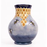 A CONTEMPORARY MOORCROFT POTTERY LARGE HONEYCOMB AND BEE PATTERN VASE on blue ground, signed to