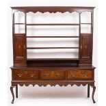 A GEORGIAN OAK DRESSER with boxwood and ebony inlay and associated plate rack above three drawers