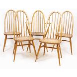 A SET OF ERCOL LIGHT ELM SPINDLE BACK CHAIRS each 102cm high, with a matched armchair (5)