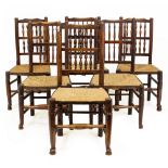 A HARLEQUIN SET OF 19TH CENTURY ASH AND ELM SPINDLE BACK KITCHEN CHAIRS with rush seats and turned