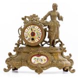 A GILT SPELTER MANTLE TIMEPIECE or clock with flower decorated porcelain dial and further inset