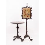 A VICTORIAN ROSEWOOD POLE SCREEN with an inset floral embroidered panel and a tripod base 145cm