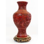 AN ORIENTAL CINNABAR LACQUER VASE of baluster form with faring rim 23cm diameter x 47.5cm high