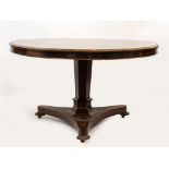 A VICTORIAN ROSEWOOD CIRCULAR BREAKFAST TABLE with an octagonal pedestal support and triform base,