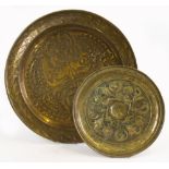 A KESWICK SCHOOL OF INDUSTRIAL ARTS CIRCULAR BRASS TRAY with chased and engraved decoration of