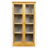 A GLAZED PINE FLOOR STANDING BOOKCASE with grey painted interior 83cm wide x 30cm deep x 160.5cm