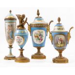 FOUR FRENCH STYLE PORCELAIN VASES WITH COVERS on gilt metal mounts with either twin cherub handle,