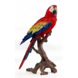 A RESIN SCULPTURE OF A RED MACAW 67cm high