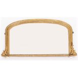 A 19TH CENTURY GILT FRAMED OVERMANTLE MIRROR with arching top and bun shaped ceramic supports
