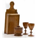 A PAIR OF TURNED FRUITWOOD GOBLETS 15.3cm high together with an old pine candle box and a turned oak