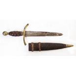 AN ANTIQUE DAGGER with leather grip and brass pommel, in scabbard 33cm overall