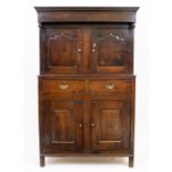 A LATE 17TH CENTURY OAK COURT CUPBOARD with twin arching panel doors above two drawers, above twin