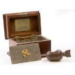 AN ANTIQUE TREEN NUT CRACKER 9cm in length and a 19th century oak tobacco box made from Bishop's