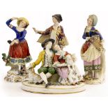 A 19TH CENTURY CONTINENTAL PORCELAIN FIGURAL GROUP depicting a shepherd and shepherdess, 15cm