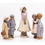A LLADRO PORCELAIN FIGURINE model number 2242 'Away to School', 27.5cm high; a further Lladro
