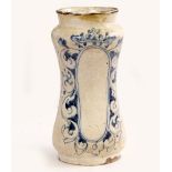 AN ANTIQUE, POSSIBLY 17TH CENTURY TIN GLAZED DRY DRUG JAR with waisted sides and scrolling cobalt