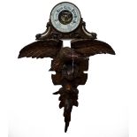 A 20TH CENTURY BLACK FOREST WOOD STYLE CARVED BAROMETER STAND depicting an eagle and an aneroid