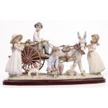A LLADRO PORCELAIN FIGURAL GROUP model number 1797 'Enchanted Outing' by Antonio Ramos, decorated by
