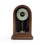 AN EARLY 20TH CENTURY MAHOGANY CASED BOULLE ELECTRIC CLOCK the silvered dial with Arabic numerals