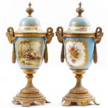 A PAIR OF LATE 19TH / EARLY 20TH CENTURY FRENCH PORCELAIN PAINTED VASES with gilt metal mounts and