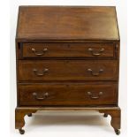 AN EDWARDIAN MAHOGANY BUREAU the fall front enclosing a fitted interior above three long drawers and