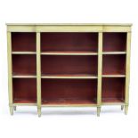 A PAINTED BREAKFRONT BOOKCASE the three central sections with adjustable shelves and raised on