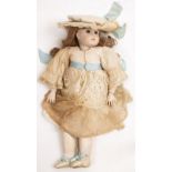 A J.STEINER OF PARIS BISQUE HEADED DOLL 57.5cm overall in silk dress with matching hat
