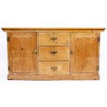 A PINE DRESSER BASE the three central drawers flanked by cupboards to either side 152cm wide x